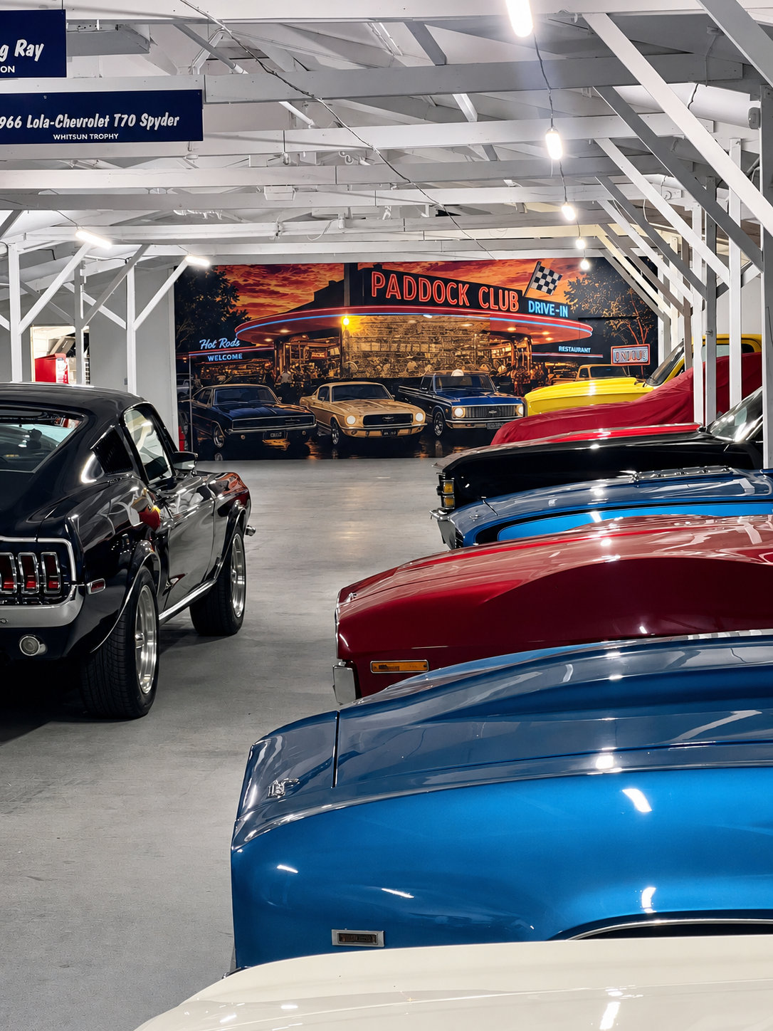 Classic American cars inside The Paddock Club
